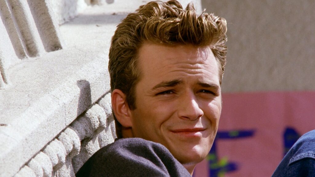 Luke Perry as Dylan McKay in Beverly Hills 90210 on CBS and Paramount+