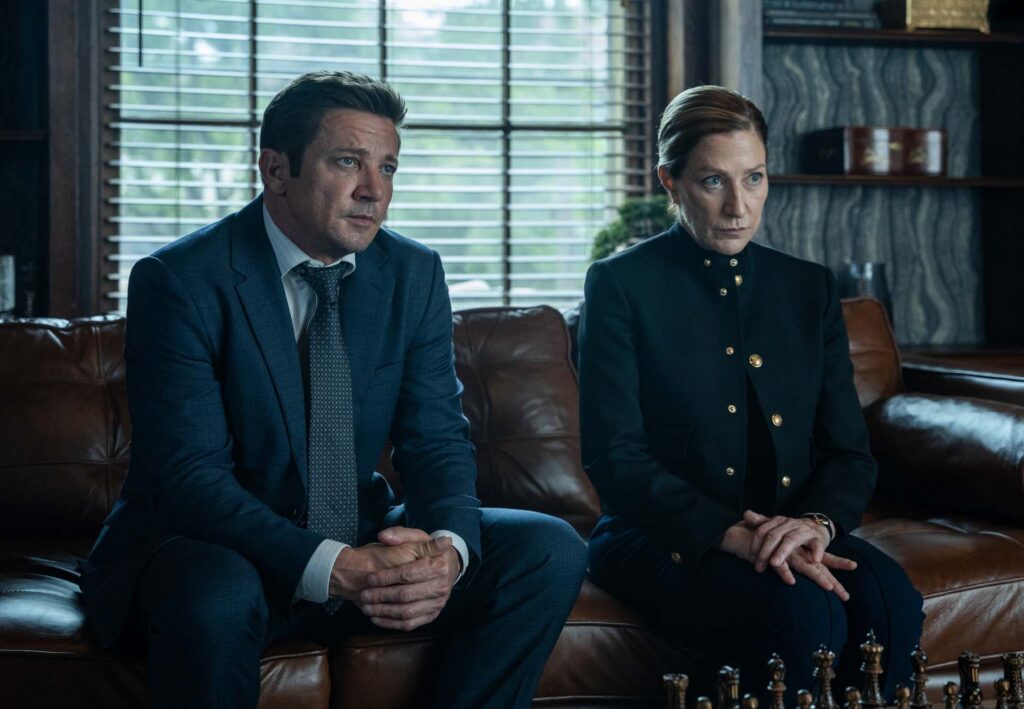 L-R: Jeremy Renner as Mike McLusky and Edie Falco as Nina Hobbs in Mayor of Kingstown season 5, streaming on Paramount+, 2027. Credit: Jeremy Parsons/Paramount+